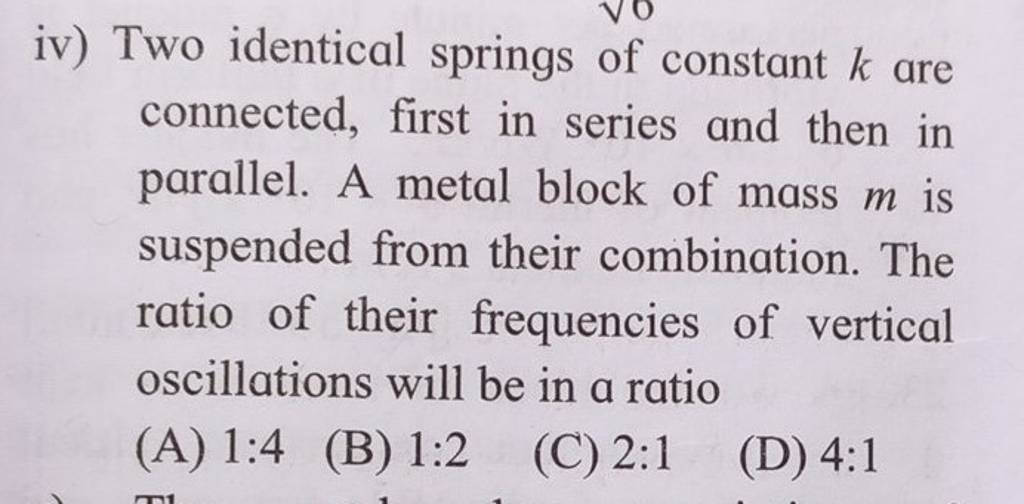 Two identical springs of constant k are connected, first in series and t..