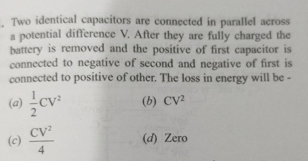 Two identical capacitors are connected in parallel across a potential dif..