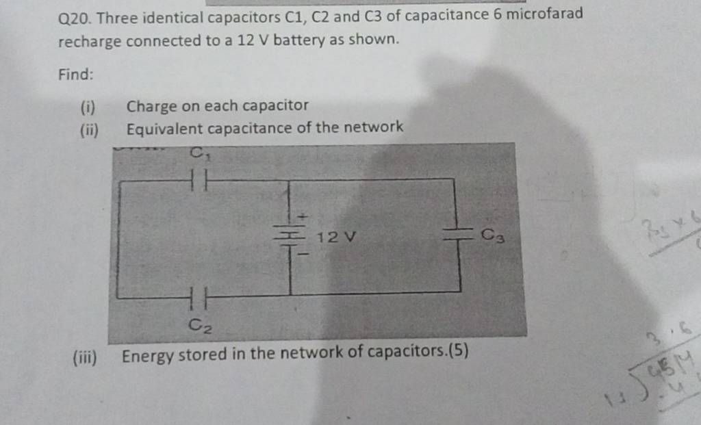Q20. Three identical capacitors C1, C2 and C3 of capacitance 6 microfarad..
