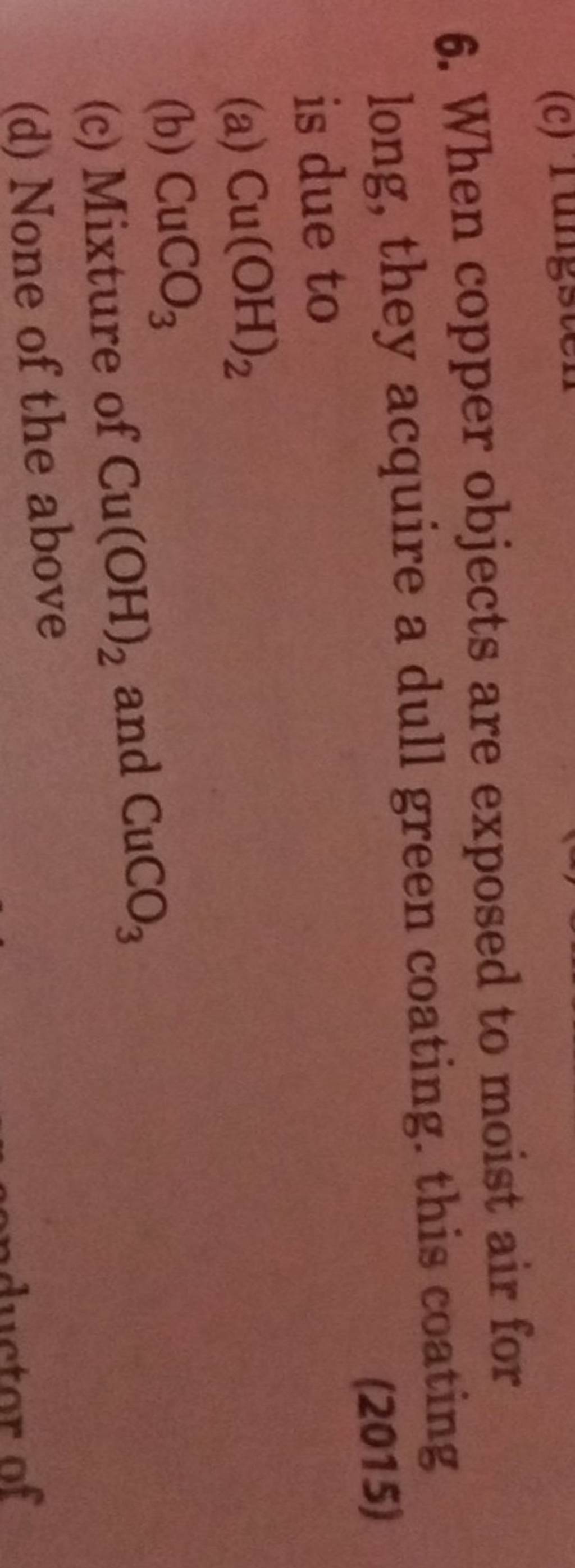 When copper objects are exposed to moist air for long, they acquire a dul..