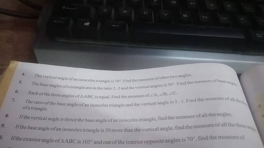 4. The vertical angle of an isosceles triangle is 70∘. Find the measure o..
