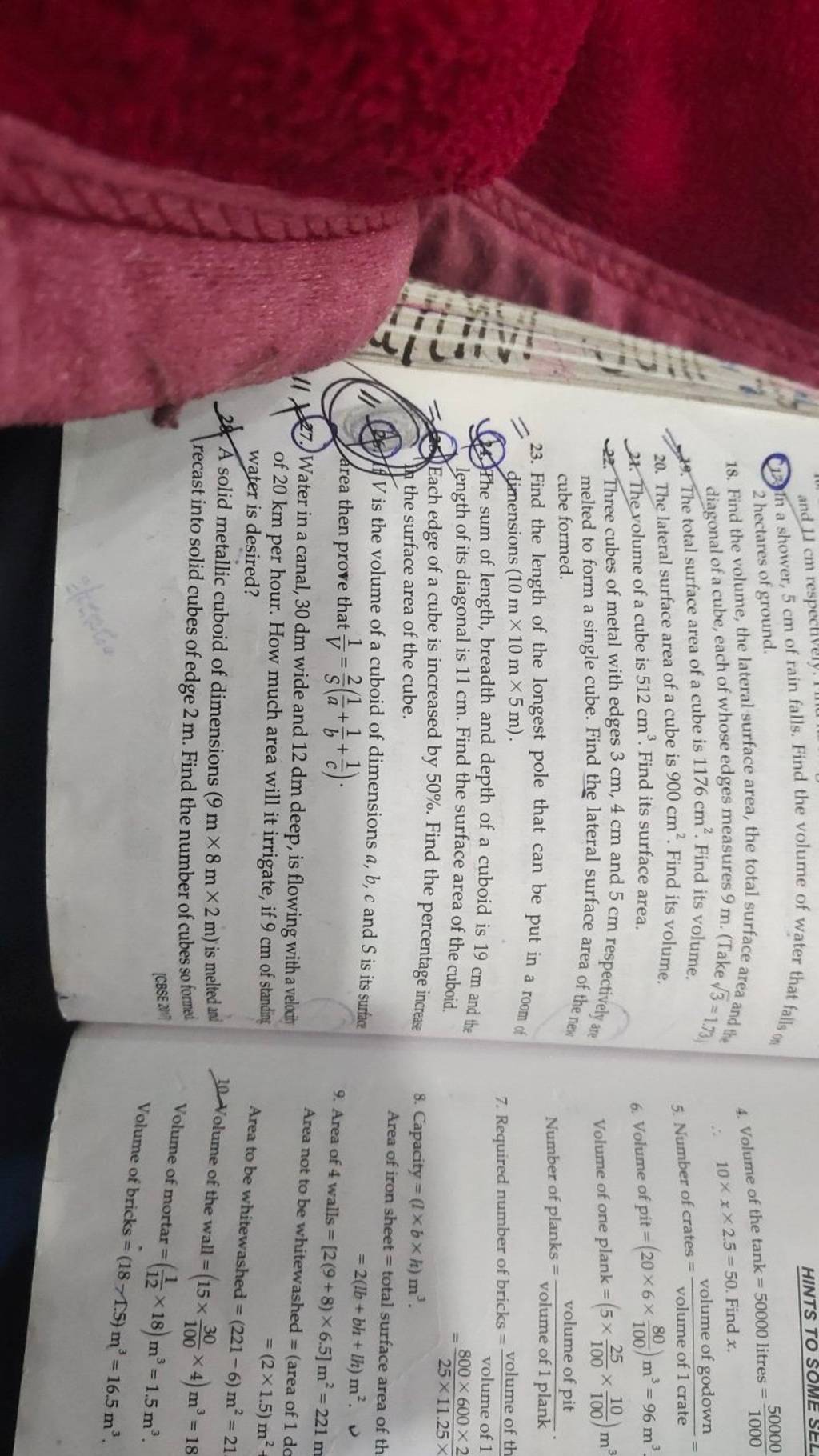 (12) In a shower, 5 cm of rain falls. Find the volume of water that falls..