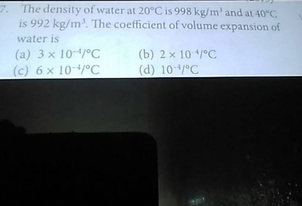 The density of water at 20∘C is 998 kg/m3 and at 40∘C is 992 kg/m3. The c..