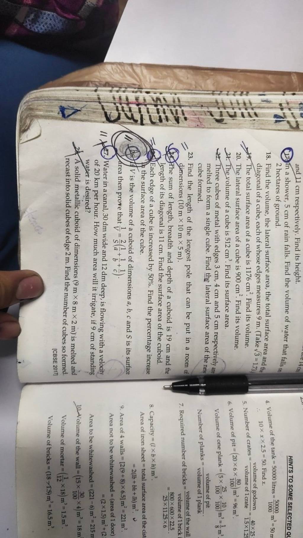 cm respectively. Find its height. In a shower, 5 cm of rain falls. Find t..