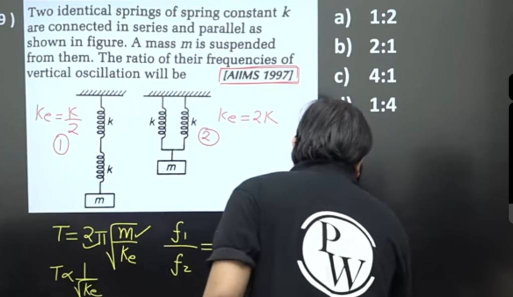 Two identical springs of spring constant k are connected in series and pa..