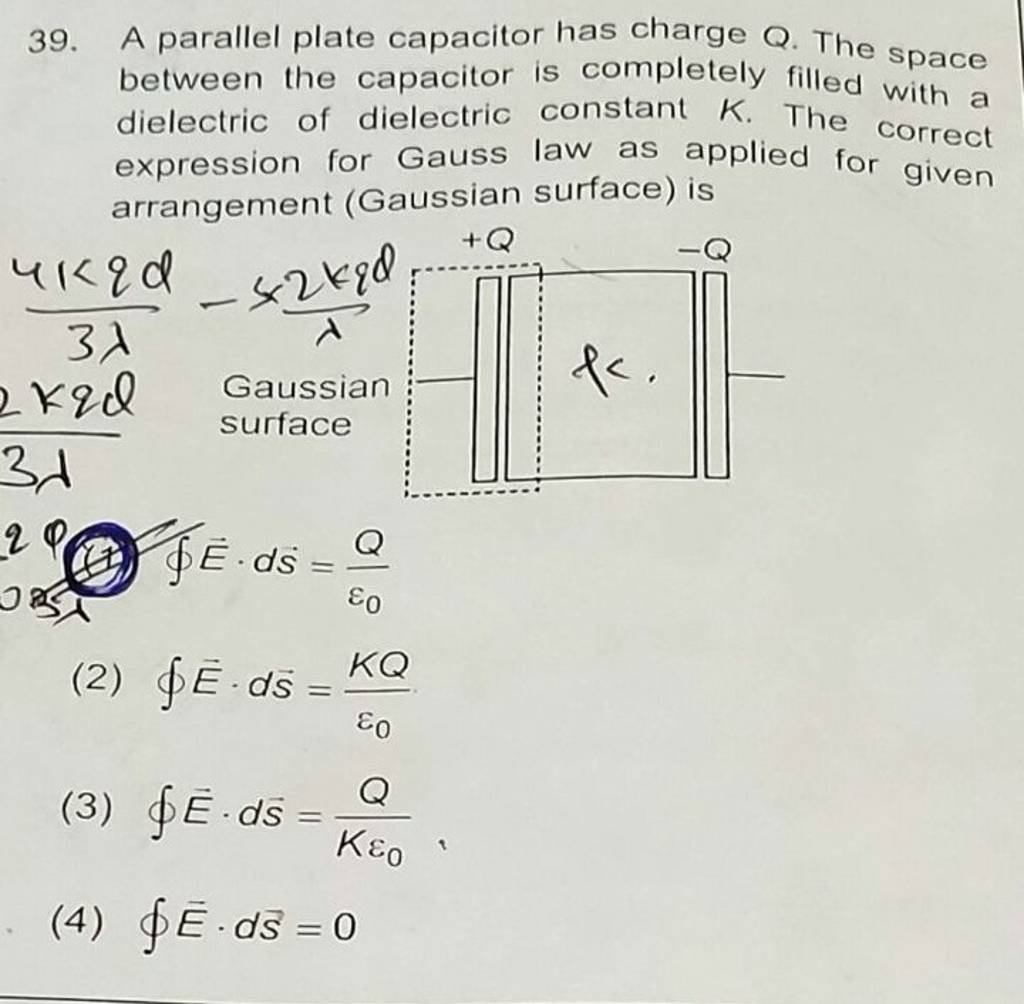 39. A parallel plate capacitor has charge Q. The space between the capaci..