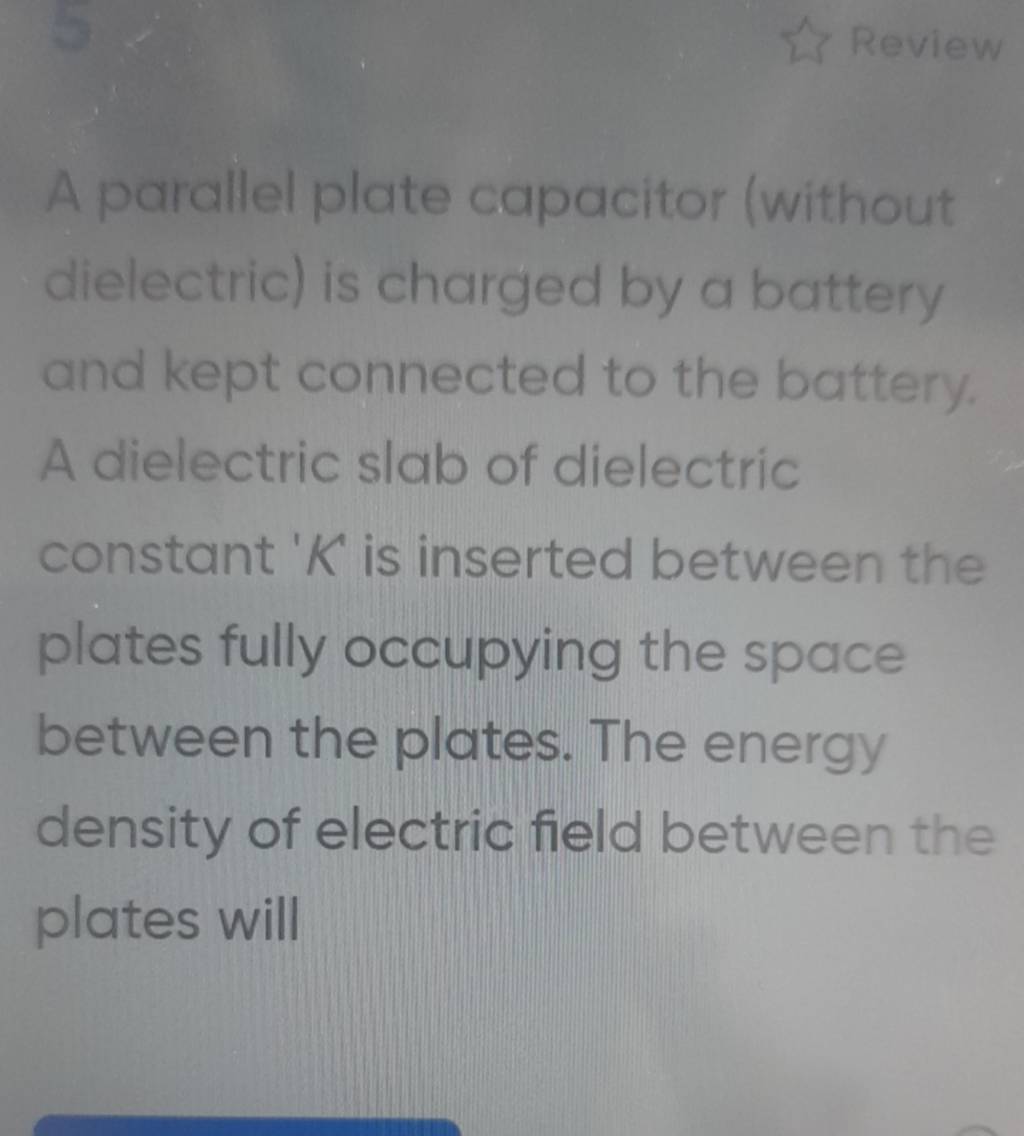 A parallel plate capacitor (without dielectric) is charged by a battery a..