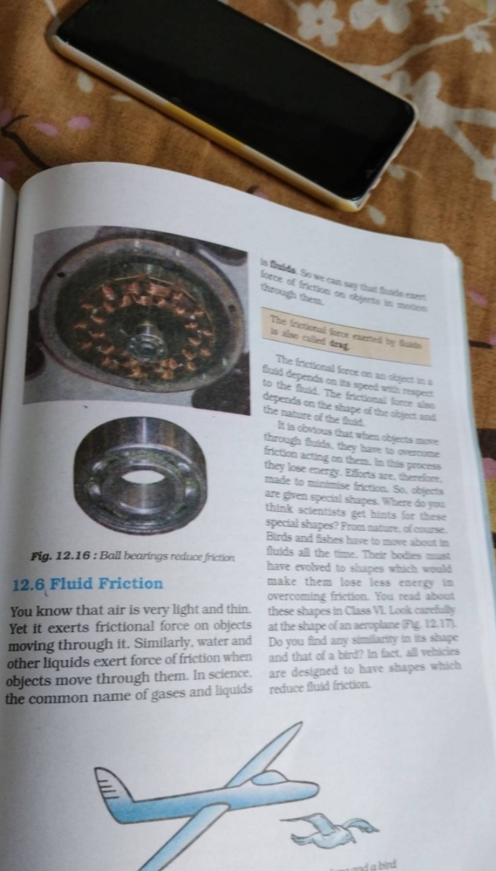 Fig. 12.16 Ball bearings reduce friction 12.6 Fluid Friction You know th..